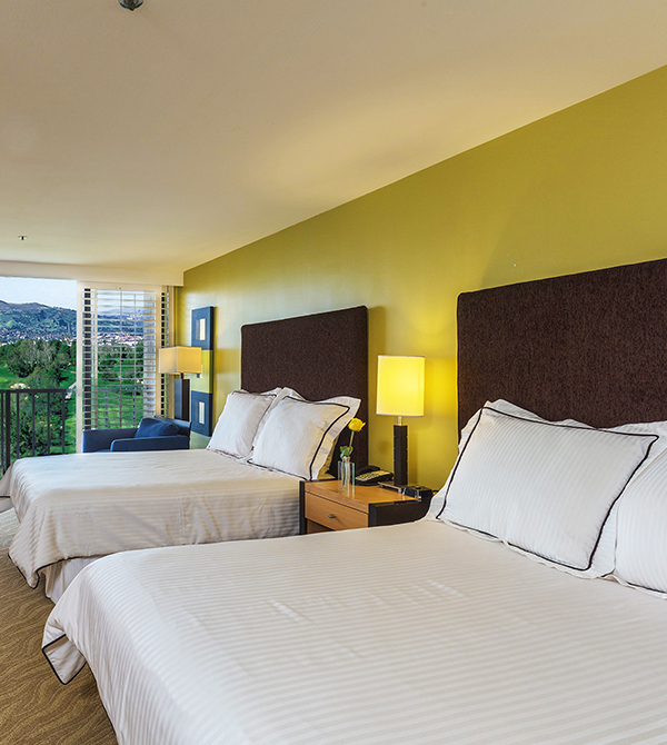 Double Deluxe beds in the room looking out over the mountains